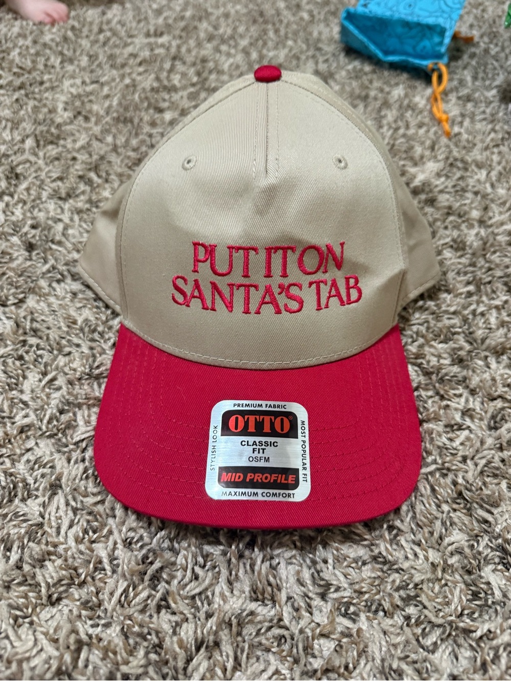 OTTO Beige and Red Baseball Cap with 'Put It On Santa's Tab' Embroidery